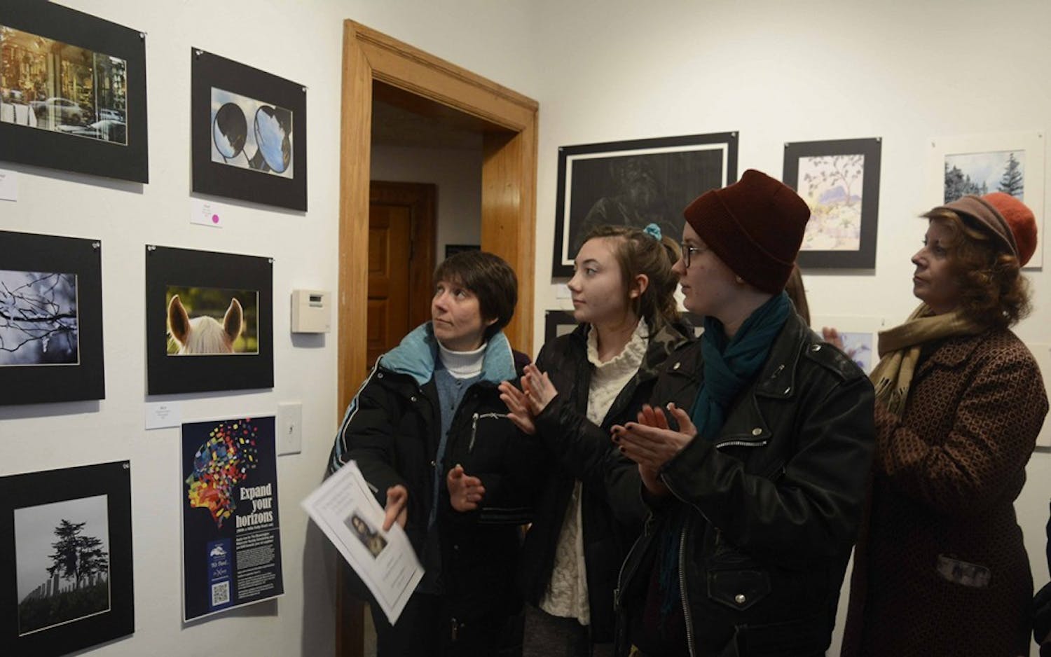 Visitors are celebrating the best photography award during the Juried Arts student show at The Venue, Fine Art & Gifts during the Juried Arts student show, Jan 29. 