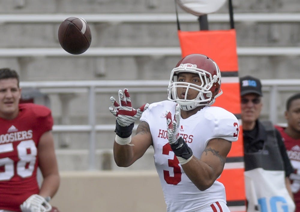 Sophomore receiver Dominique Booth catches a pass during IU's spring game Saturday at Memorial Stadium.
