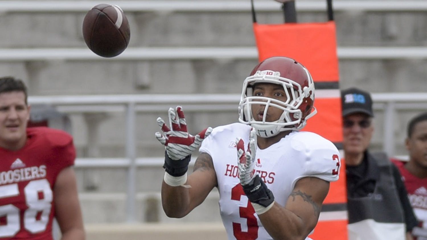 Sophomore receiver Dominique Booth catches a pass during IU's spring game Saturday at Memorial Stadium.