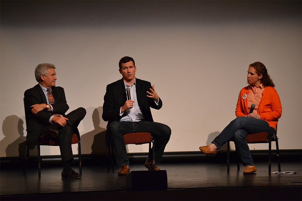 Senior Policy Advocate at Everytown for Gun Safety Colin Goddard (middle) joins in on a panel discussion with Director of IU's Civic Leaders Living-Learning Center Paul Helmke and Indiana Chapter Leader of Moms Demand Action for Gun Sense in America Stephanie Mannon Grabow Sunday afternoon at the Buskirk-Chumley Theater.