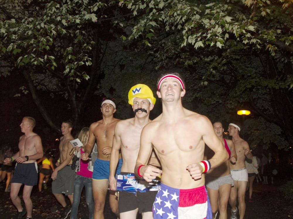 Participants in last year’s Nearly Naked Mile run through the IU Bloomington campus on Oct. 1, 2012.