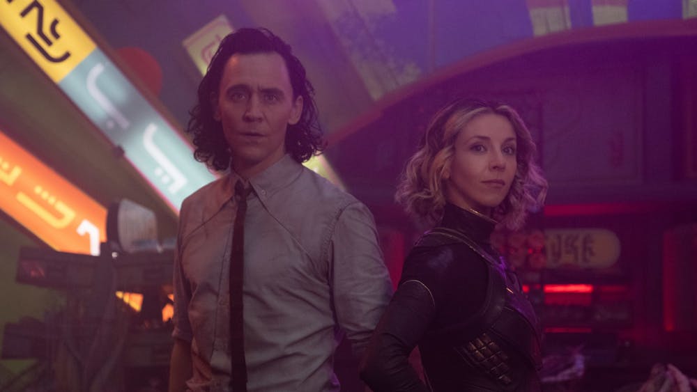 Loki and Sylvie stand next to one another in the Disney Plus series &quot;Loki&quot;. The series finale began streaming Wednesday.