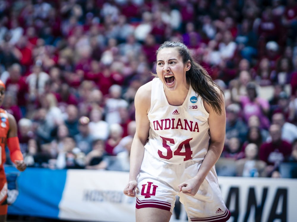 Senior forward Mackenzie Holmes celebrates a turnover March 20, 2023, at Simon Skjodt Assembly Hall in Bloomington. Holmes was announced a Wooden Award finalist Thursday evening.
