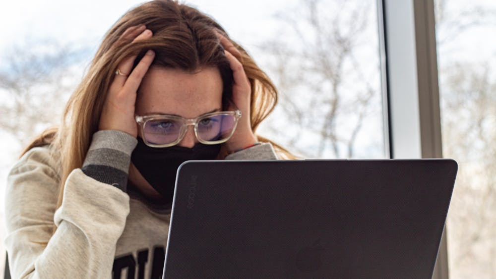 Then-freshman Emma Gagnon stares frustrated at her laptop. IU issued an alert Thursday that people may face difficulties accessing various IU websites.