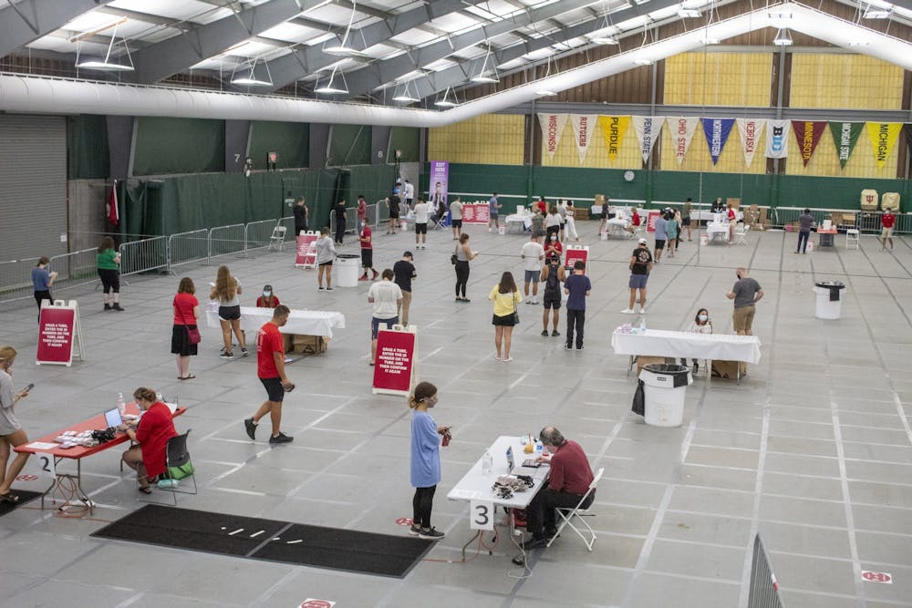 <p>Students line up for their off-campus housing COVID-19 tests Aug. 18 in the IU Tennis Center. All students living in off-campus housing are required to schedule a COVID-19 test by Aug. 20.</p>