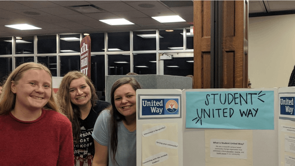 Student United Way Executive Board members, left to right, Lauren Mardis, Sheridan Smith and Sydney Evans stand around a poster describing Student United Way. The Executive Board of the new club mirrors a nonprofit, giving students a chance to experience nonprofit leadership.&nbsp;
