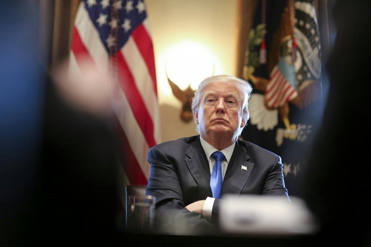 President Trump listens during a meeting with legislators on immigration reform in the Cabinet Room of the White House on Jan. 9, in Washington, D.C.