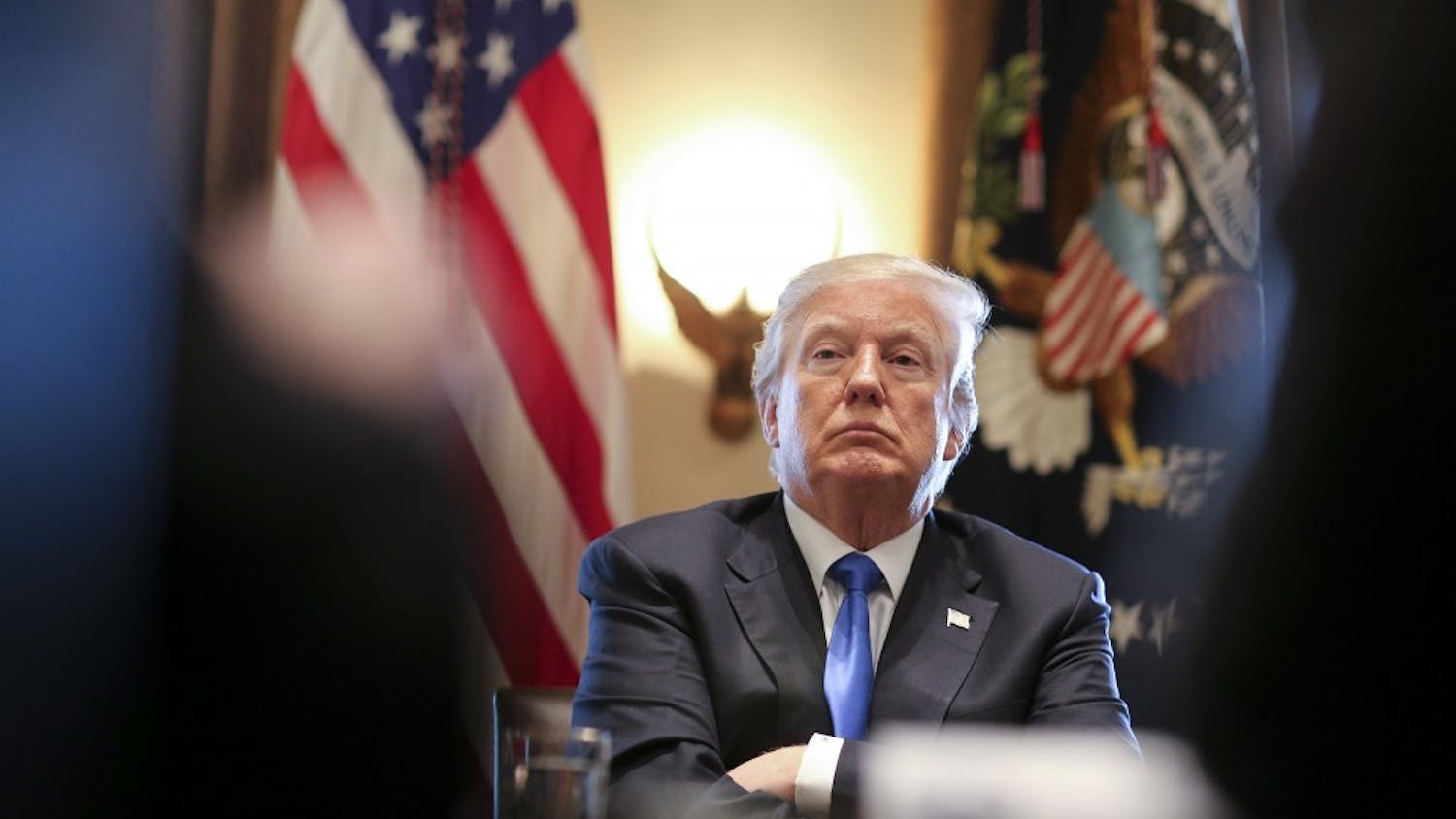President Trump listens during a meeting with legislators on immigration reform in the Cabinet Room of the White House on Jan. 9, in Washington, D.C.