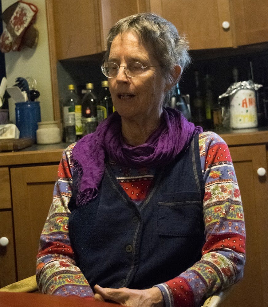 Ann Kreilkamp talks about astrology at her apartment Tuesday evening. Ann Kreilkamp studied philosophy at Boston College. She taught at an New College of California in California for one year until she was fired. After leaving the New College of California she began studying astrology and pursues it as a hobby. She is the outreach coordinator for the Green Acres Permaculture Village. 