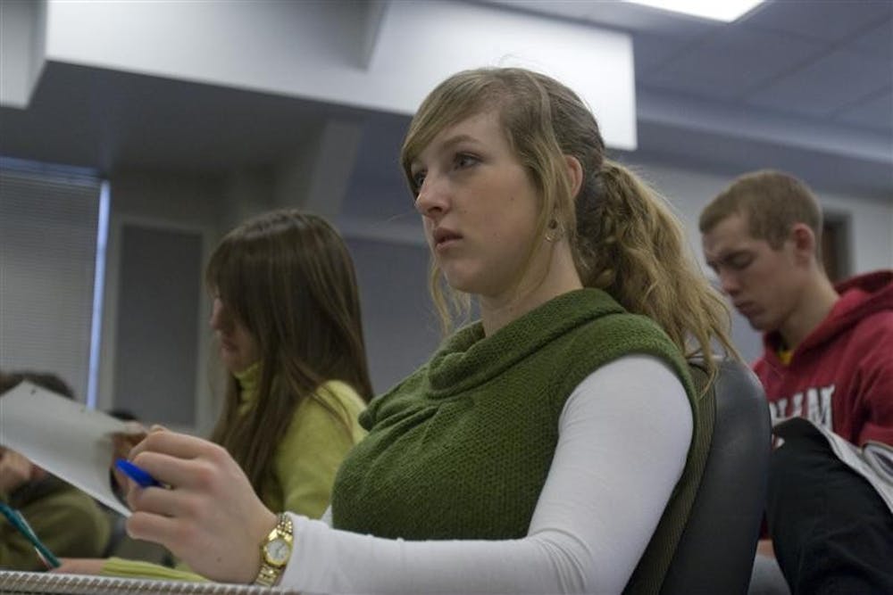 Sophomore Charlotte Martin listens to a lecture during one of her journalism classes. Martin, a journalism major, is taking 15 credit hours this semester along with nightly practices and weekend matches.