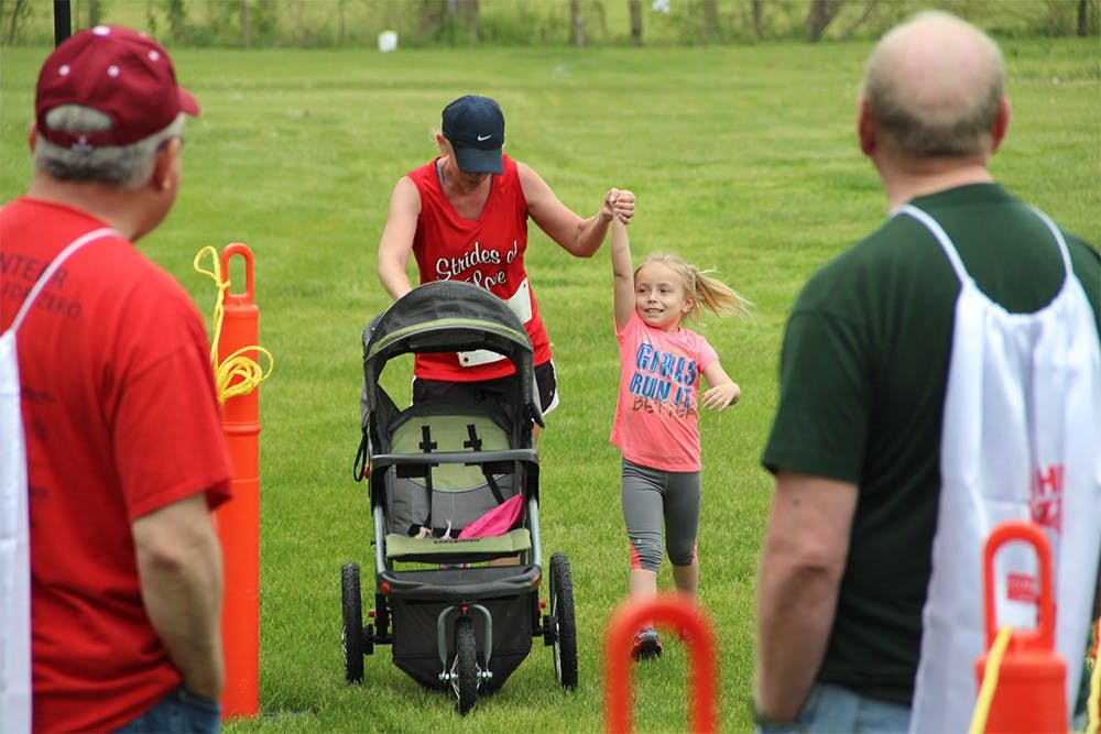 Kristine Malia and Aubrey Mangia crossed the finish line at the "Hero for Zero" 5k Saturday.