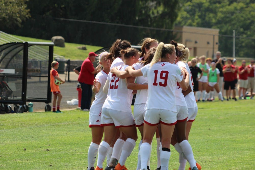 <p>The IU women's soccer team celebrates its first goal of the season, scored by senior forward Annelie Leitner on Sunday, Aug. 19 at Bill Armstrong Stadium. The team is 2-0 in Big Ten Conference play this season.</p>