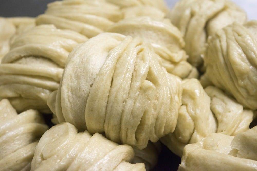 Handed made steam buns are prepared for sell on Thursday afternoon at Little Tibet. The owner of Little Tibet, Pema Wangchen, is a native tibetian. 