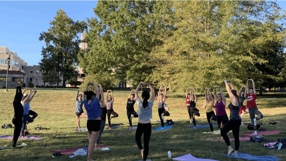 Emily Isaacman leads a yoga class for the Movement Cooperative on Sept. 26 in the Arboretum.