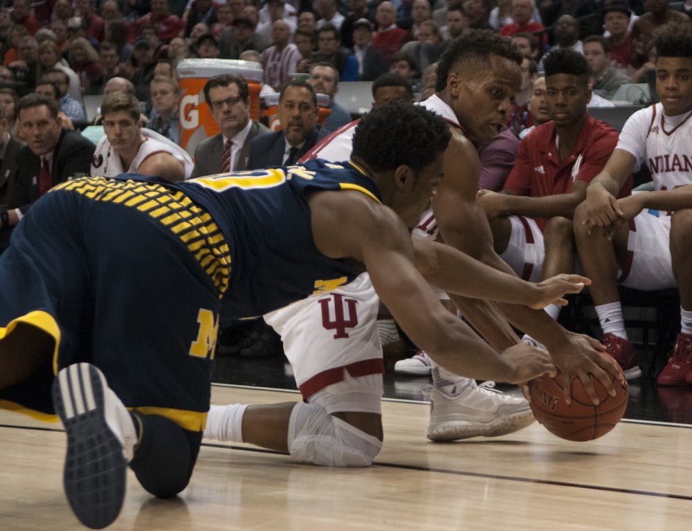 Senior guard Yogi Ferrell goes after the loose ball during the Big Ten Tournament game against Michigan on Friday at Bankers Life Fieldhouse. The Hoosiers lost 72-69.