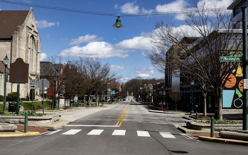 <p>Kirkwood Avenue appears empty March 29 near the Graduate Hotel. Gov. Eric Holcomb issued a stay-at-home order March 23 asking Hoosiers to stay inside. </p>