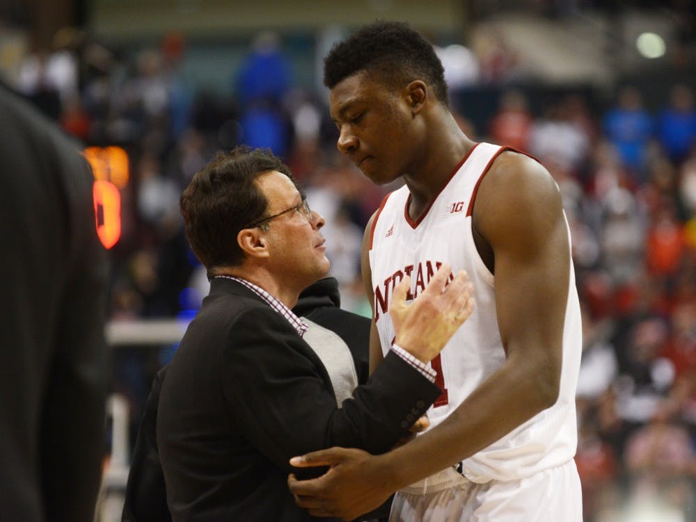 IU Coach Tom Crean embraces freshman center Thomas Bryant following the 72-69 loss to Michigan in the Big Ten Tournament on Friday at Bankers Life Fieldhouse. 