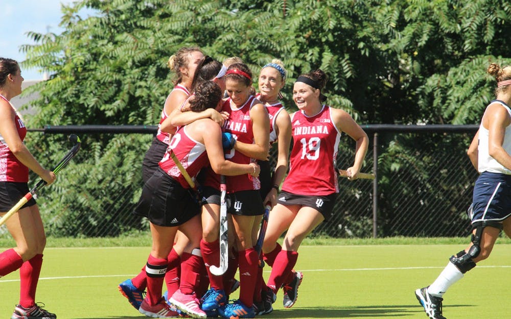 The IU Women’s Field hockey team celebrates their first goal in their game Sunday against the University of New Hampshire at the IU Field Hockey Complex.