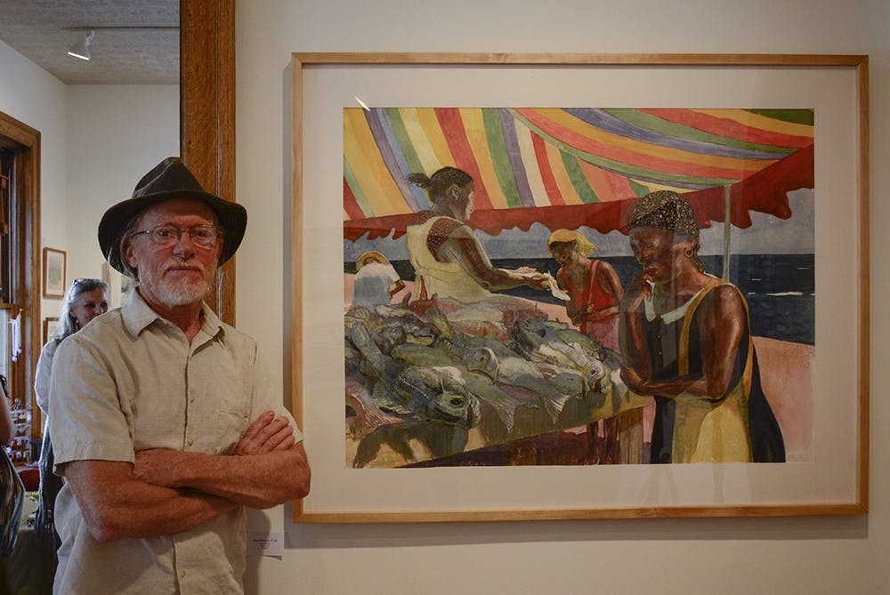 Mark Blaney stands in front of his favorite work "She Chooses Fish". The Venue Fine Art & Gifts is hosting an exhibition of his latest work, including drawings, watercolors and small sculptures. 