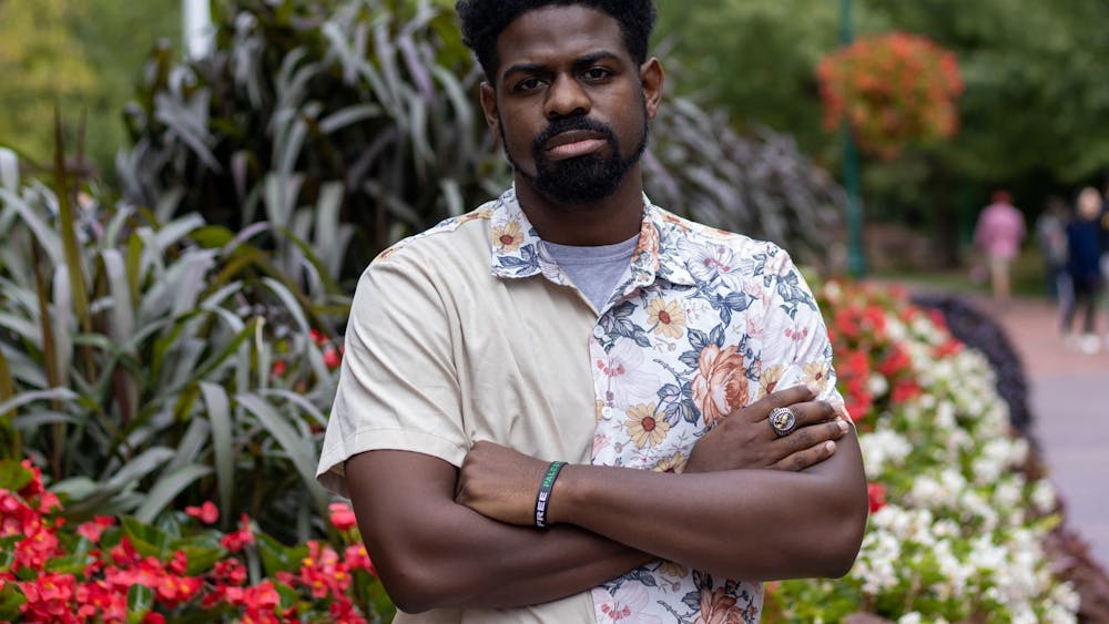 Travis Washington, the creator of the Hands Up Act petition which calls for police officers who shoot unarmed citizens to serve a mandatory 15-year prison sentence, poses for a portrait Sept. 23, 2022, outside of Franklin Hall. As of this month, Washington&#x27;s petition has over 2.7 million signatures.