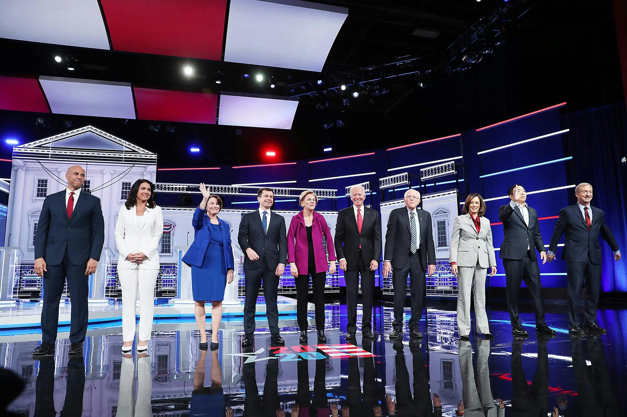 Democratic presidential candidates arrive on stage before the start of the Democratic presidential debate Wednesday at Tyler Perry Studios in Atlanta.