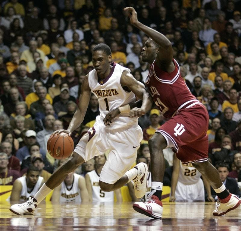 Minnesota forward Paul Carter (1) drives around Indiana guard Nick Williams (20) during the second half Tuesday in Minneapolis. Carter had a game-high 22 points as Minnesota won 62-54.