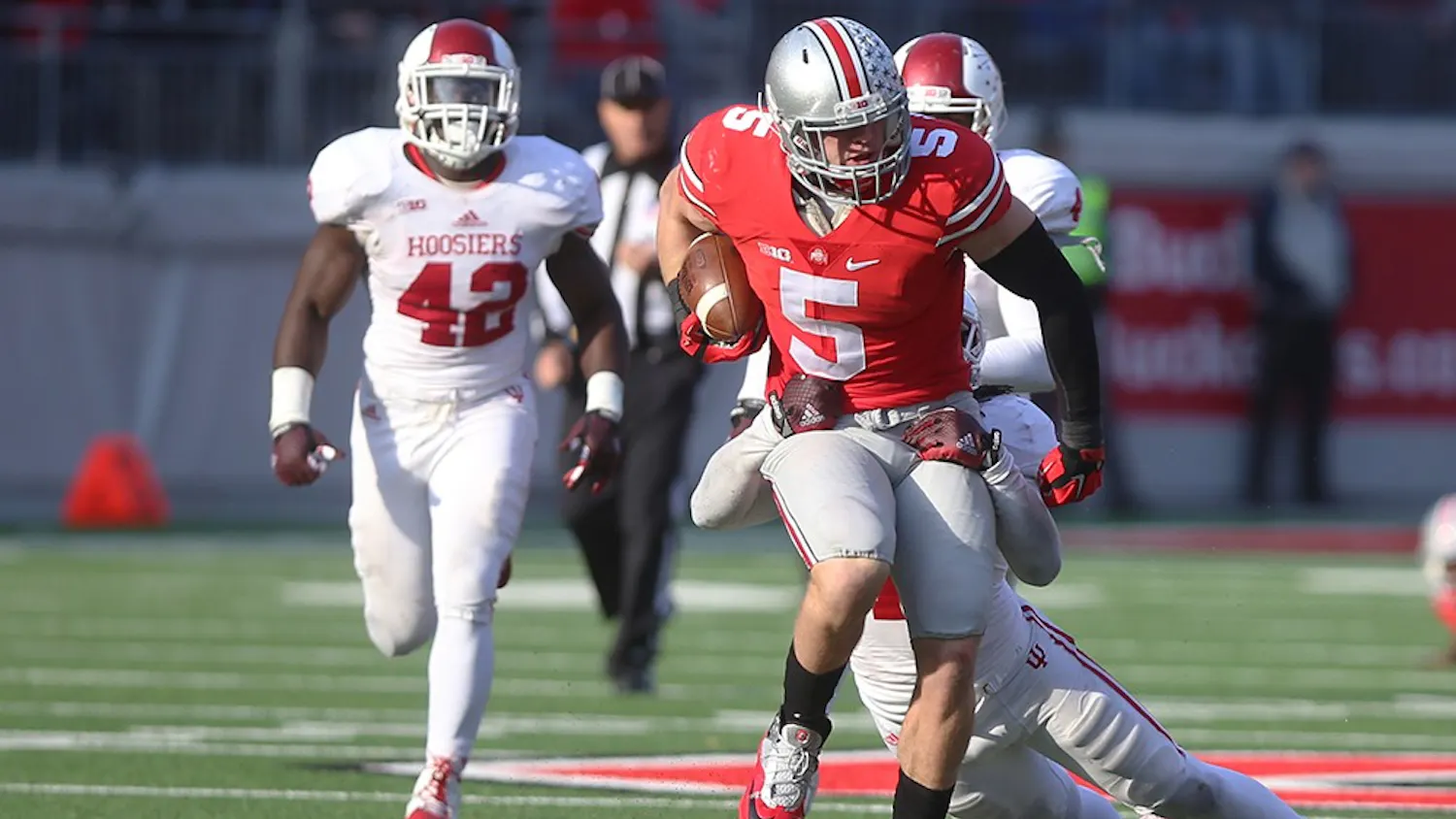 IU safety Antonio Allen tackles Ohio State tight end Jeff Heuerman. The Hoosiers lost to the Buckeyes 42-27 at Ohio Stadium on Saturday.