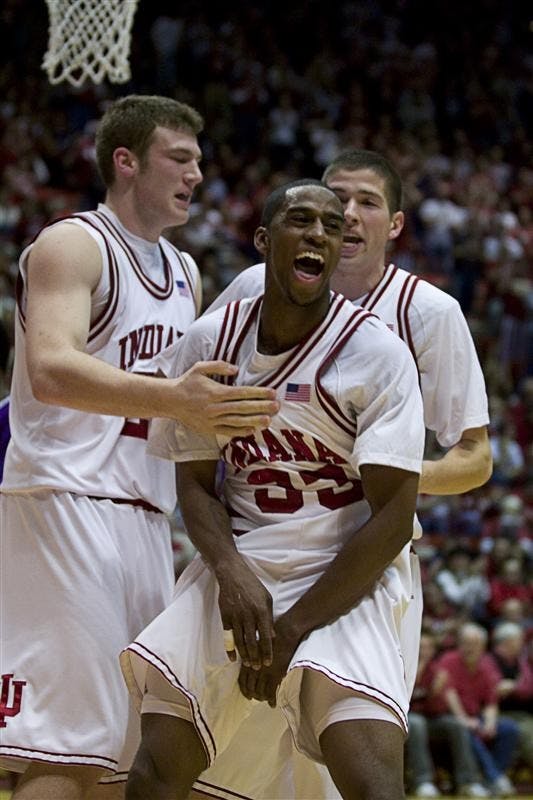 Junior guard Devan Dumes celebrates after scoring a basket and drawing a foul Wednesday against TCU at Assembly Hall