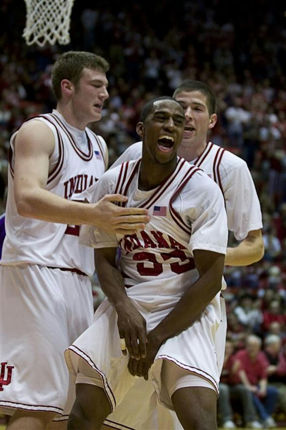 Junior guard Devan Dumes celebrates after scoring a basket and drawing a foul Wednesday against TCU at Assembly Hall