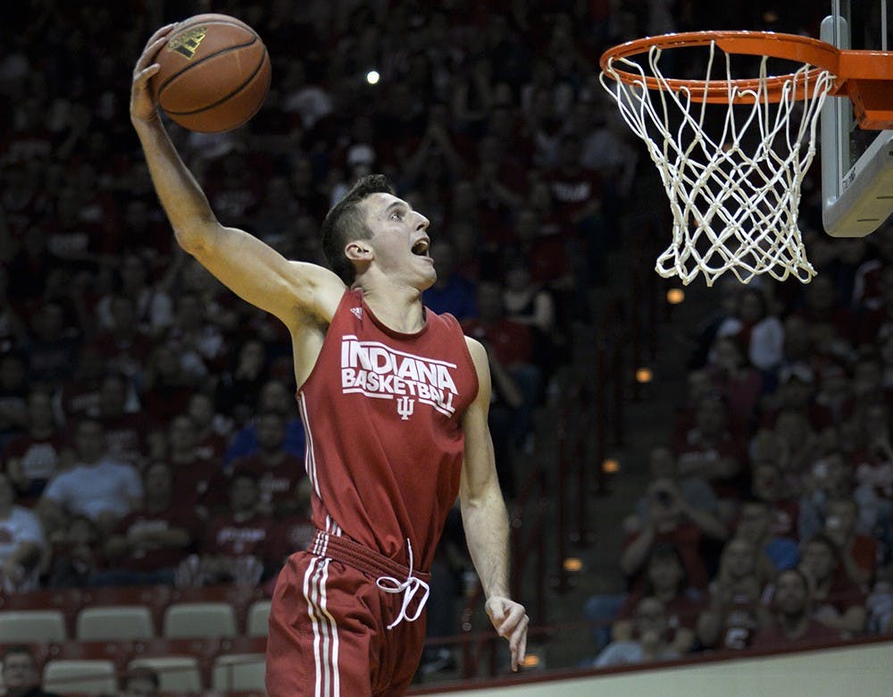 Freshman Nate Ritchie attempts his first dunk during the Hoosier Hysteria dunk contest Saturday at Assembly Hall. Ritchie later won the contest.