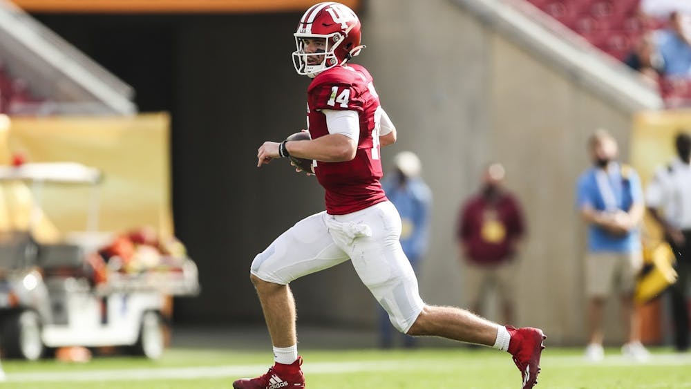 Then-sophomore quarterback Jack Tuttle runs the ball Jan. 2, 2021, at Raymond James Stadium in Tampa, Florida. Indiana football will play Illinois on Sept. 2, 2022 in their first game of the season.  