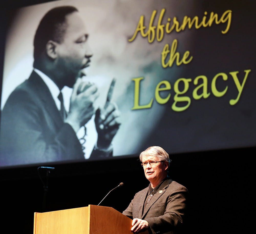 Mayor John Hamilton gives a greeting speech to audiences to celebrate the 2016 Martin Luther King Jr. Day Monday at the Buskirk-Chumley Theater. The mayor spoke how the American society has been through and how Americans are still facing the challenge against racism and violence. The mayor also presented Martin Luther King, Jr. Legacy Award. 