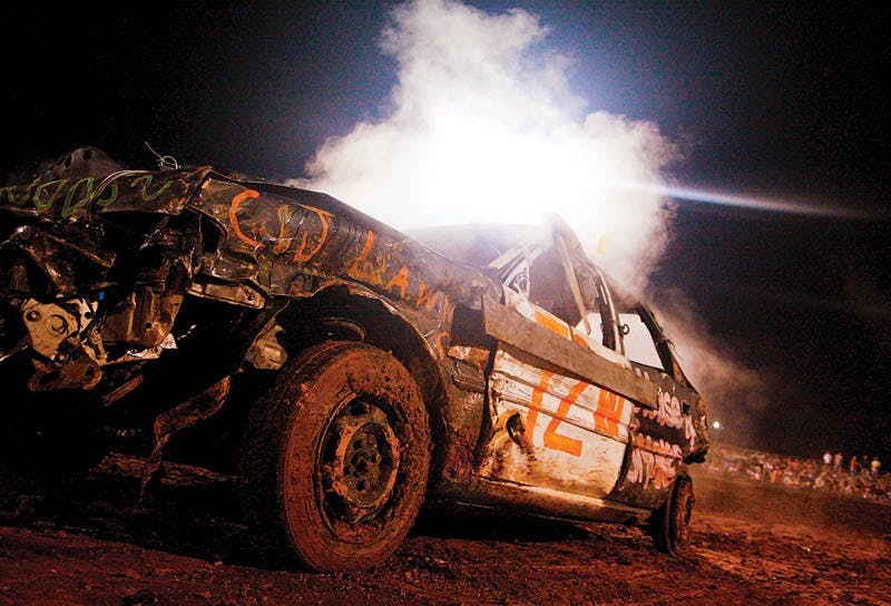 Smoke rises from a derby car Friday evening at the Monroe County Demolition Derby. The derby featured cars in mini, midsize and full-size classes, as well as the women’s powder puff, in which this year’s Monroe County Fair Queen, Juli Johnston, participated.