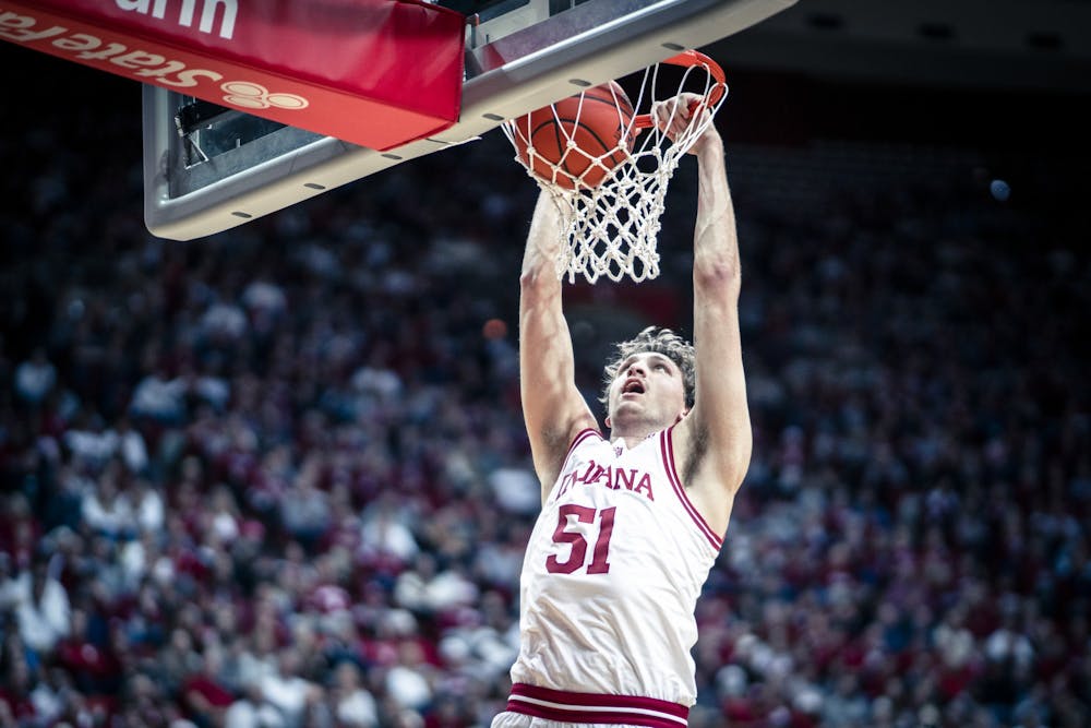 Sophomore center Logan Duncomb dunks the ball Dec. 20, 2022, at Simon Skjodt Assembly Hall in Bloomington, Indiana. Duncomb entered his name in the transfer portal on Thursday.