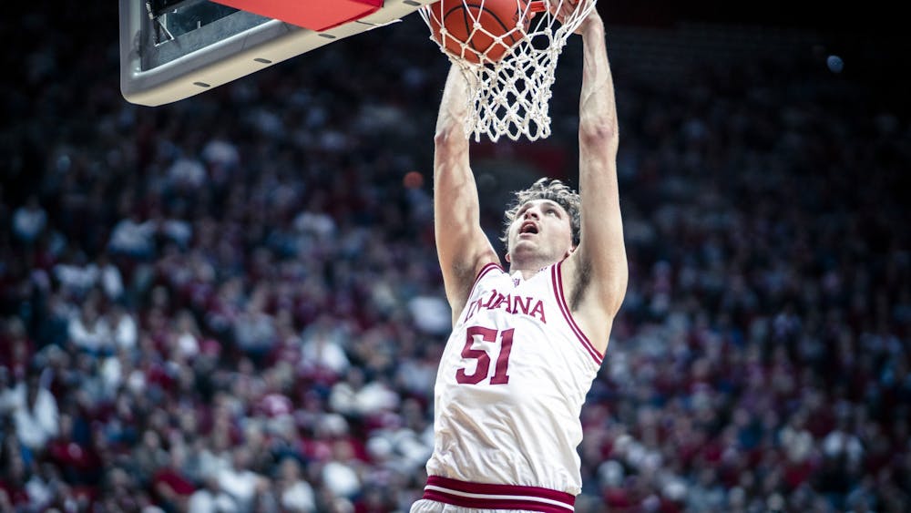 Sophomore center Logan Duncomb dunks the ball Dec. 20, 2022, at Simon Skjodt Assembly Hall in Bloomington, Indiana. Duncomb entered his name in the transfer portal on Thursday.