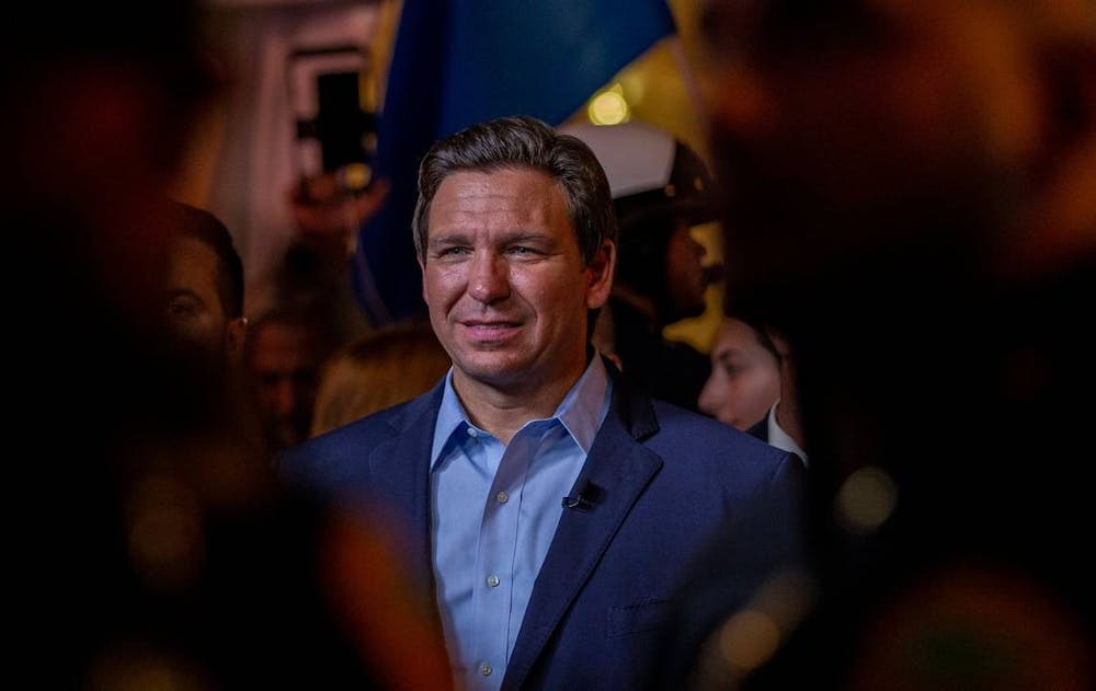 <p>Florida Gov. Ron DeSantis is seen July 21, 2021, at Versailles Restaurant. In 2021, DeSantis signed House Bill 5, which requires the implementation of “patriotic programs” in Florida schools.</p>