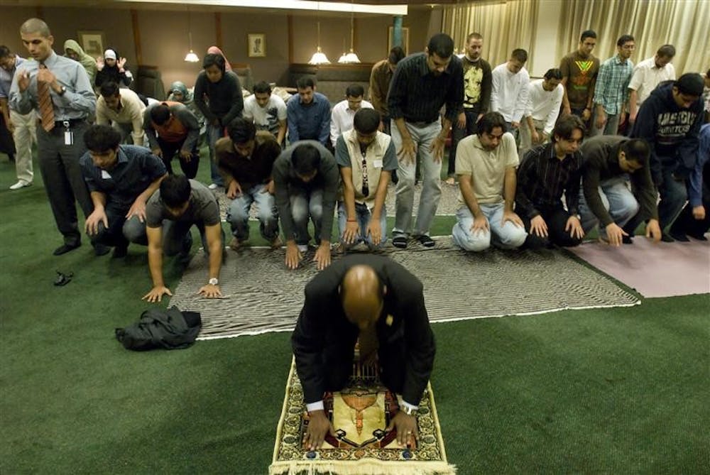 Islamic Society of North America Affiliates Coordinator Rodwan Saleh leads a prayer during the breaking of the month-long Ramadan fast Tuesday night in the Forest Greenleaf quad. The annual Fast-A-Thon,  which was sponsored by the IU Muslim Student Union, promoted awareness of hunger in the community and reached out to many non-Muslims and members of the community who joined in fasting for the day.