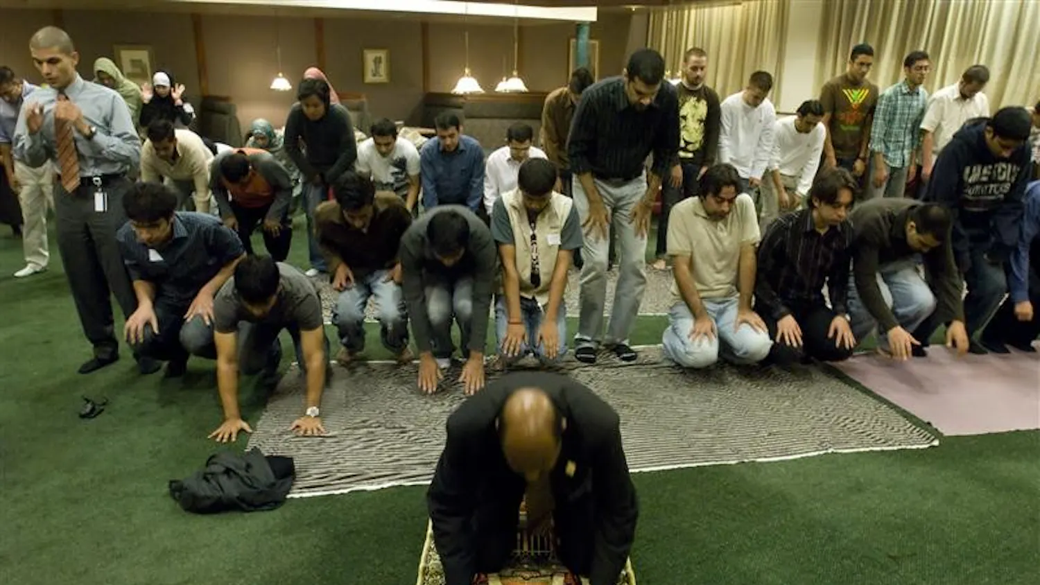 Islamic Society of North America Affiliates Coordinator Rodwan Saleh leads a prayer during the breaking of the month-long Ramadan fast Tuesday night in the Forest Greenleaf quad. The annual Fast-A-Thon, which was sponsored by the IU Muslim Student Union, promoted awareness of hunger in the community and reached out to many non-Muslims and members of the community who joined in fasting for the day.