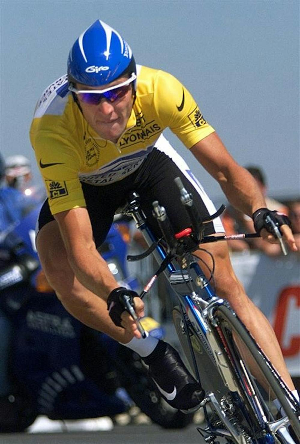 Overall leader Lance Armstrong of the U.S. rounds a corner during the 19th stage of the Tour de France cycling race, a 57-kilometer individual time trial on July 24, 1999 around the Futuroscope theme park near Poitiers, western France. 