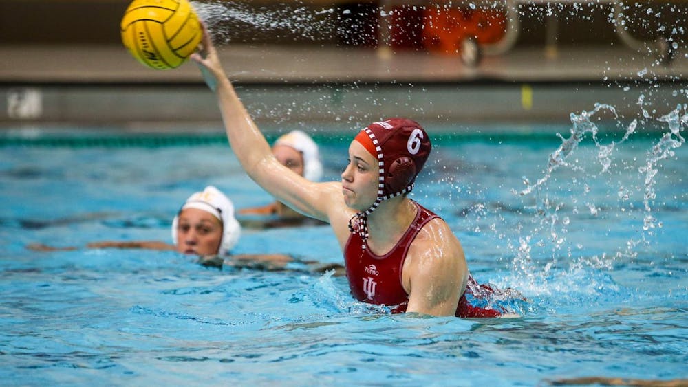 Then-sophomore attacker Lanna Debow throws the ball April 2, 2021, at the Counsilman Billingsley Aquatics Center. Indiana lost all three games it played Feb. 20, 2022, all against top-25 teams.
