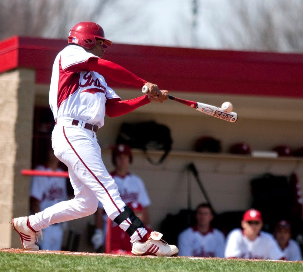 <p>IU third baseman Micah Johnson hits a leadoff double July 22, 2018, during the Hoosiers' 7-3 win over Taylor University at Sembower Field.</p>