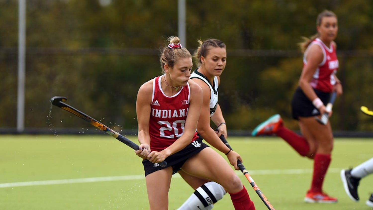 Senior forward Maddie Latino takes a shot against Michigan State on Oct. 15 at the IU Field Hockey Complex. Latino scored the final goal for IU this season in a loss to Ohio State.