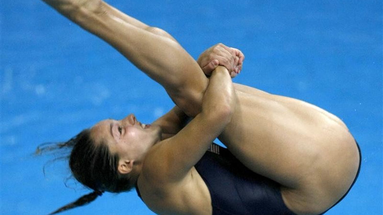 USA's Christina Loukas of Riverwoods, Illinois, does a forward 3-1/2 somersault dive while competing in the women's 3M Springboard finals on Sunday, August 17, 2008, in the Games of the XXIX Olympiad in Beijing, China.