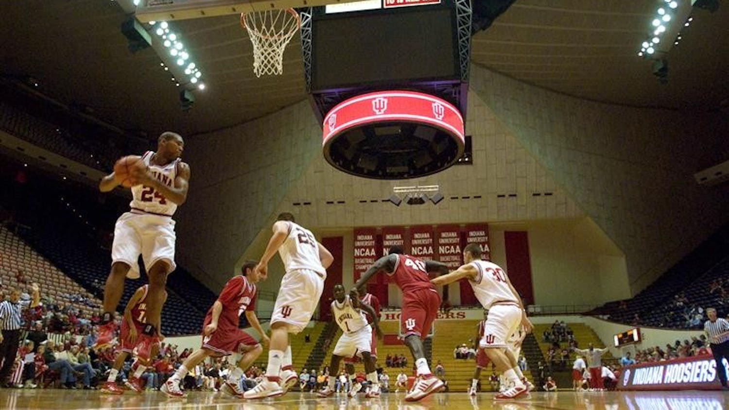 IU junior forward Steven Gambles grabs a rebound for the Cream team during a scrimmage during the "Haunted Hall of Hoops" on Oct. 31 at Assembly Hall. The team will open the season with a game verses Anderson at 7 p.m. tonight at Assembly Hall.