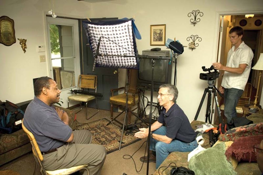 COURTESY PHOTOTelecommunications professor and facilities manager Ron Osgood, center, sets up to film the Vietnam War veteran on the left, identified as Arthur. The interview is part of "My Vietnam Your Iraq," which will be shown Friday at the Radio/TV Center. The film documents the stories of Vietnam vets whose own children served in Iraq.