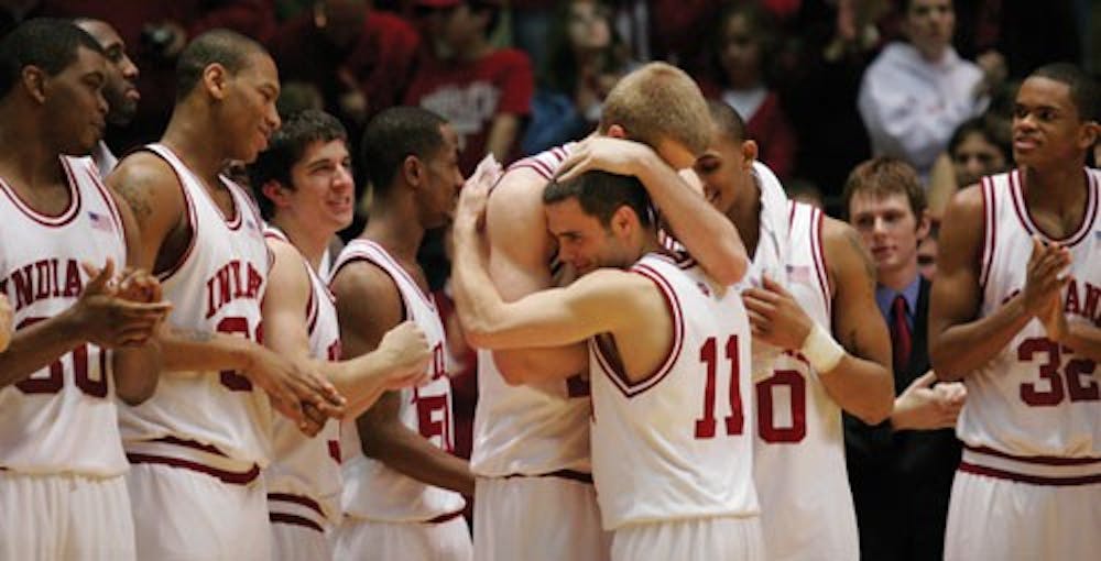  IU senior guard Errek Suhr embraces junior forward Lance Stemler during postgame festivities for senior night after the Hoosiers’ 94-63 win against Penn State. The Hoosiers finished the season 15-0 at Assembly Hall.