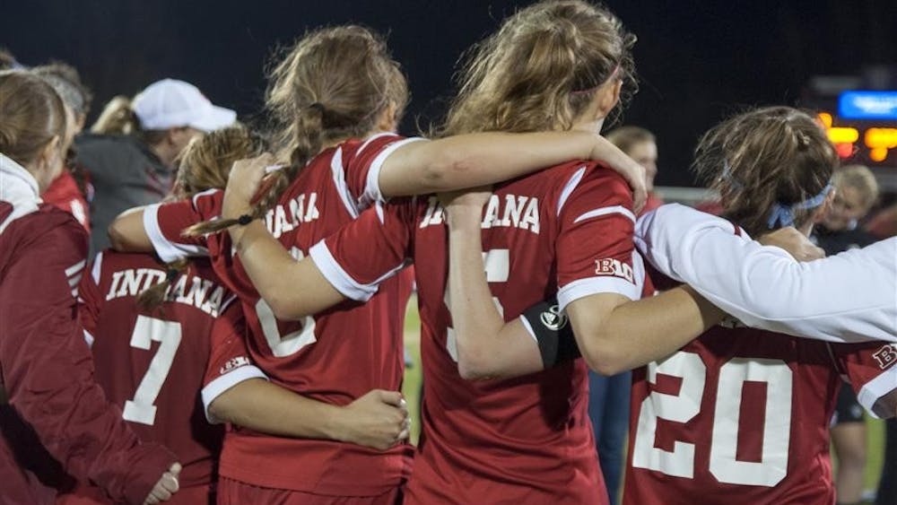 Members of the Women's Soccer team huddle together after the match against DePaul on Saturday at Bill Armstrong Stadium. IU advanced to the second round of the NCAA Tournament by beating DePaul 1-0.