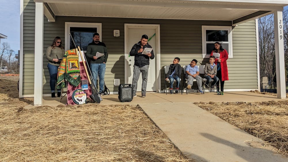 The Cortez family poses for a photo at their new Habitat for Humanity home March 30, 2023. Angela and Crispin Cortez began to volunteer for Habitat for Humanity of Monroe County to build their own home in 2019.