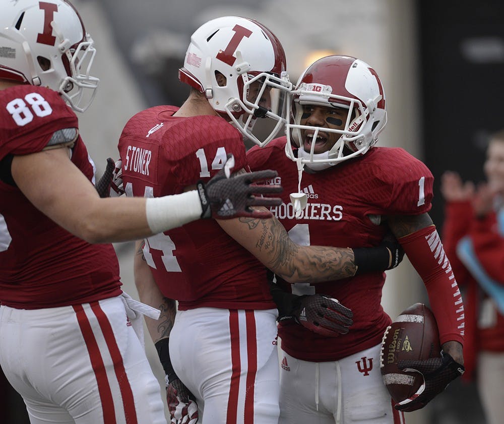 Members of the IU football team celebrate during the game against Purdue on Nov. 29, 2014. IU's spring game will be April 18.