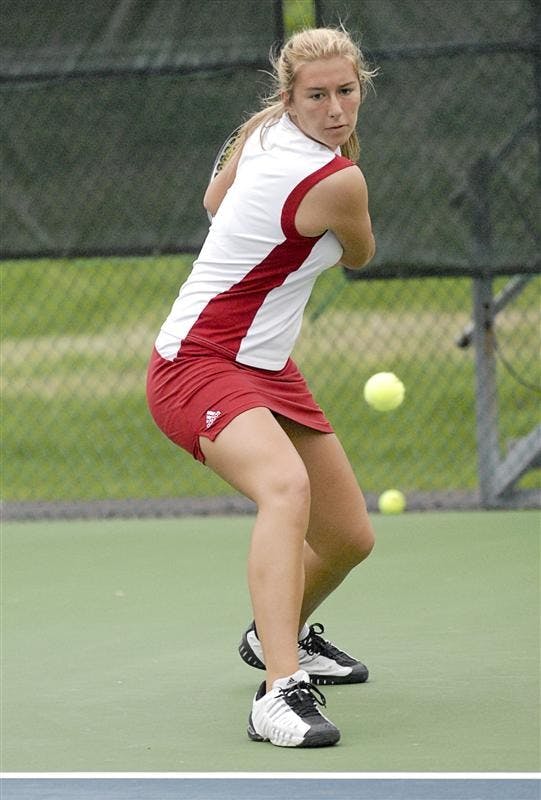 Sophomore Katya Zapadalova watches the ball as she prepares to hit a backhand against Minnesota on Saturday afternoon at the IU Tennis Courts. Zapadalova won her match in three sets.